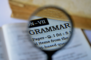 The word 'grammar' seen though a magnifying glass